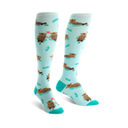 Pair of teal knee-high socks with a pattern of brown otters holding hands and small hearts.  Simple leaf designs are also scattered on the socks.