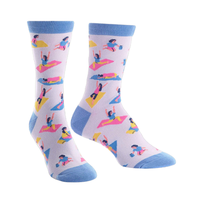 Pair of lavender crew socks with colorful yoga illustrations and light blue cuffs.  Fun and quirky design for yoga lovers!
