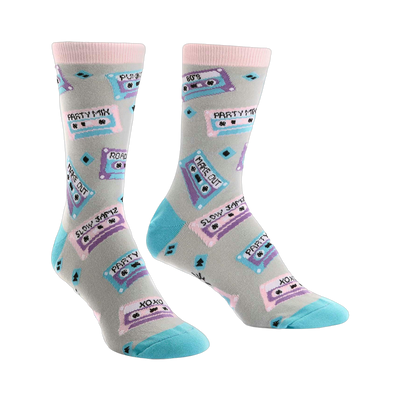 A pair of crew socks with a light grey background, featuring colorful retro cassette tapes and 80's themed text.