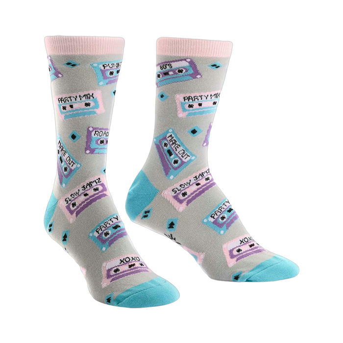 A pair of crew socks with a light grey background, featuring colorful retro cassette tapes and 80's themed text. }}