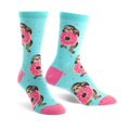 A pair of pastel blue crew socks features sloths hugging pink donuts and light blue sprinkles.  The socks have pink heels and toes.