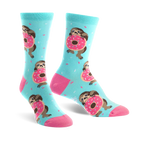 A pair of pastel blue crew socks features sloths hugging pink donuts and light blue sprinkles.  The socks have pink heels and toes.