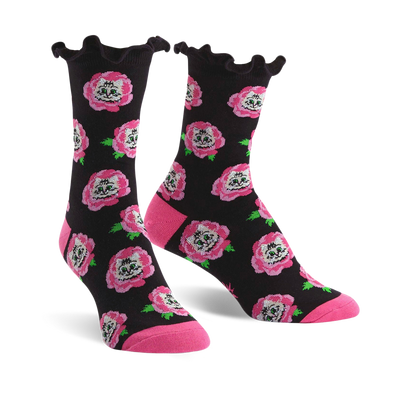 black crew socks with a pattern of pink roses, green leaves and white cat faces. ruffled pink edge at top.   