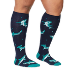Lifestyle shot showing the Shark Attack knee-high socks on a person's legs.  The socks are in focus and look comfortable.