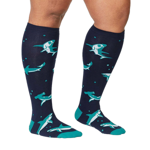 Lifestyle shot showing the Shark Attack knee-high socks on a person's legs.  The socks are in focus and look comfortable.