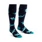 Pair of navy blue knee-high socks with teal hammerhead sharks and small white bubbles. Fun and playful design.