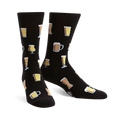 Pair of black crew socks with a pattern of various beer glasses in beige and yellow. Fun and festive!