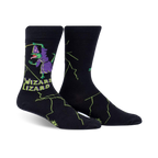Crew socks in black with a whimsical design of a purple lizard wizard casting a spell amidst green lightning bolts. Text reads 'Wizard Lizard'.