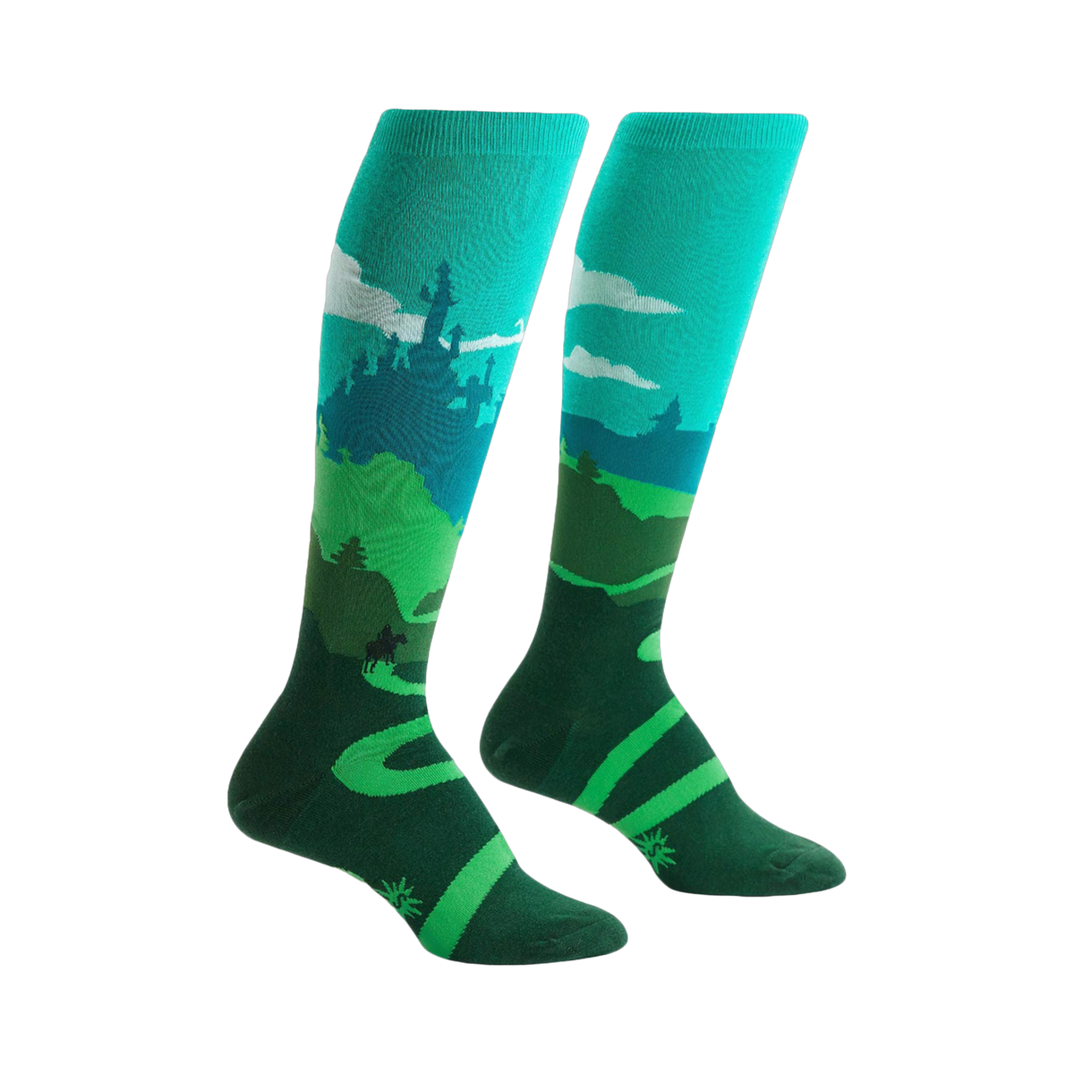 Pair of teal and green knee-high socks depicting a whimsical landscape with a castle, winding road, and a moose.