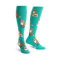 Pair of teal knee-high socks with a playful pattern of orange foxes wearing boxes on their heads. 