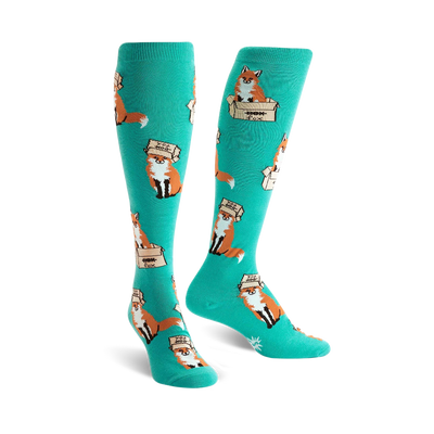 womens knee high "foxes in boxes" novelty wildlife socks in mint green with red foxes wearing brown boxes.   