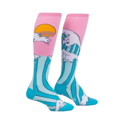 Pair of knee-high socks. Pink at the top with a teal wave design, white highlights, and a yellow sun graphic.