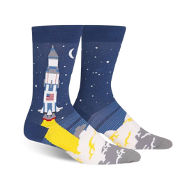 blue crew socks designed for men featuring a cartoon rocket launching into space against a starry night sky.  