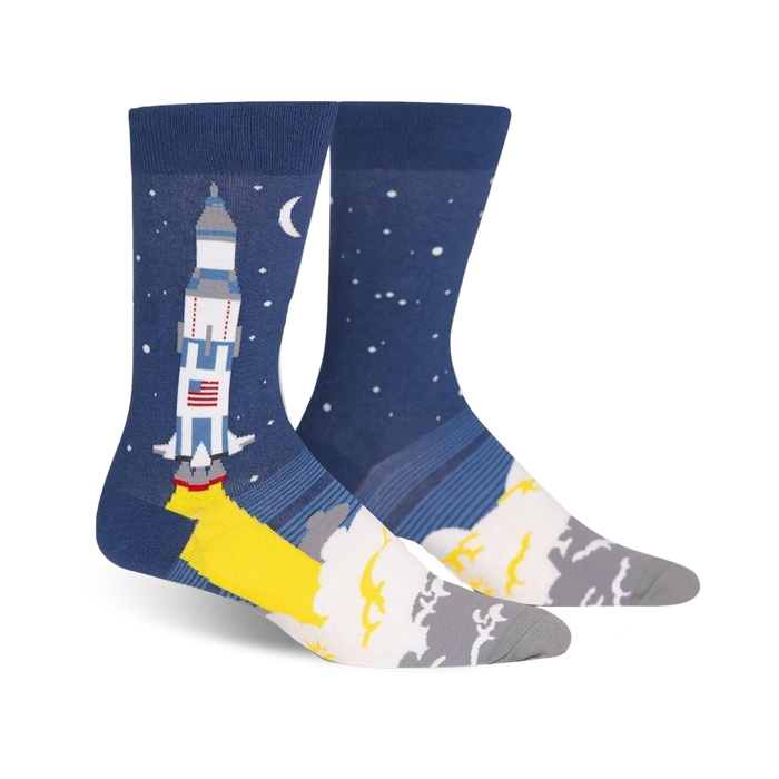 blue crew socks designed for men featuring a cartoon rocket launching into space against a starry night sky.   }}