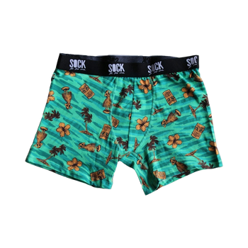 Teal men's boxer briefs with a tropical print. Design includes tiki masks, hula dancers, palm trees, and hibiscus flowers.