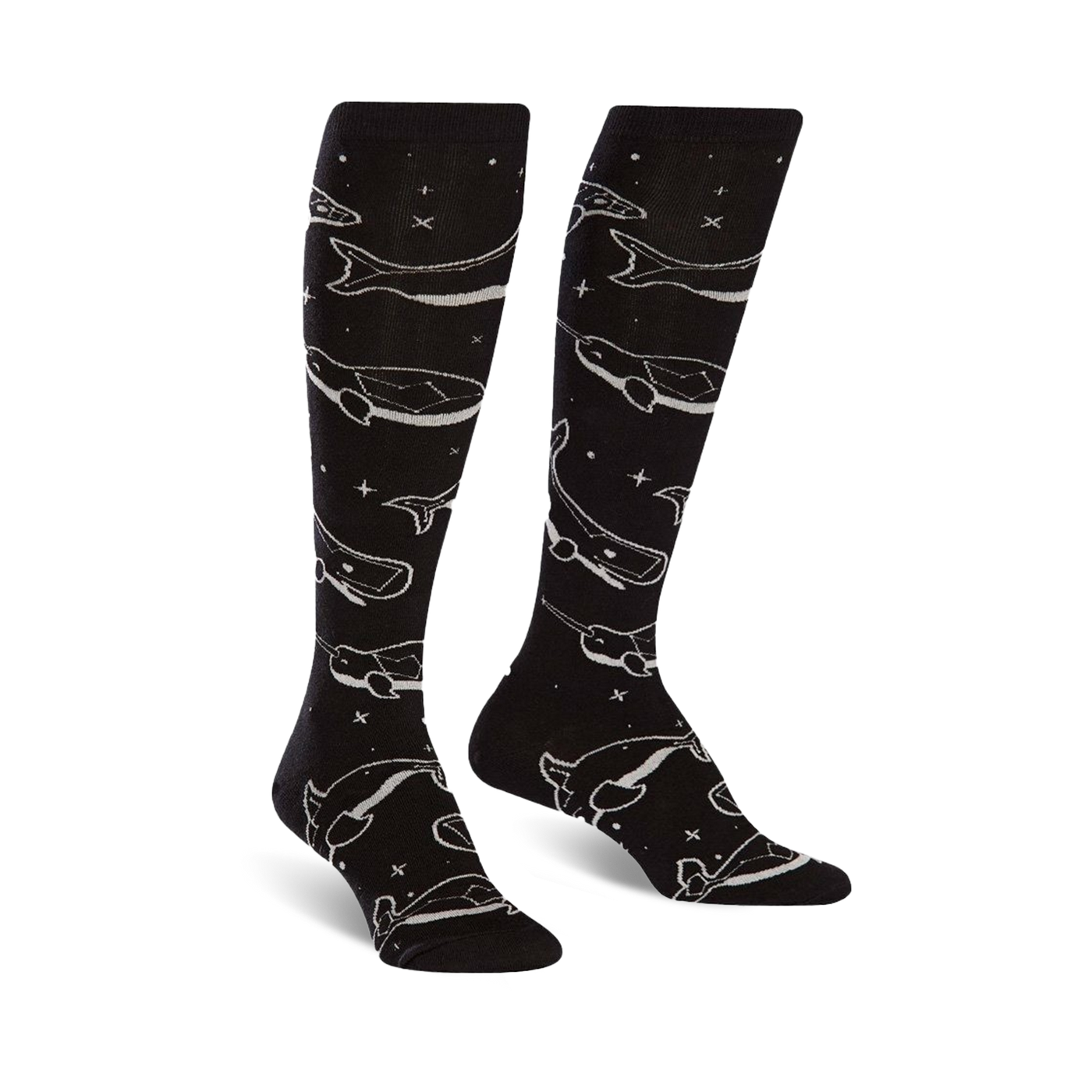 Pair of black knee-high socks with a repeating pattern of light grey whales and stars. The socks glow in the dark.