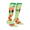 Knee-high socks in light green with a red panda design. The pandas are on bamboo branches, and their tails wrap around the socks.
