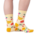 Lifestyle shot of a person wearing the Fruity Bloom socks, showcasing how they look when worn.