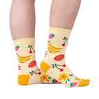 Lifestyle shot of a person wearing the Fruity Bloom socks, showcasing how they look when worn.