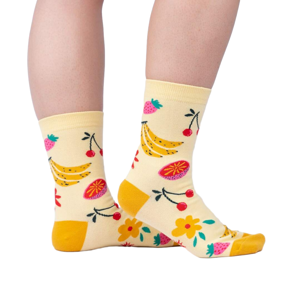 Lifestyle shot of a person wearing the Fruity Bloom socks, showcasing how they look when worn.