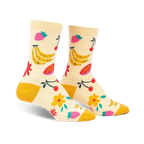 Cream crew socks with a playful fruit design. Bananas, strawberries, cherries, and flowers in yellow, pink, and red are featured on a light yellow background.