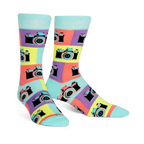 A pair of crew socks with a retro camera design. The socks are teal, purple, yellow, and orange, with black camera details.