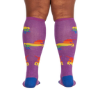 Back view of the socks on a person's legs; showcases the sock's full design and fit.