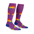 Pair of purple knee-high socks with rainbow unicorn designs.  Blue cuffs.