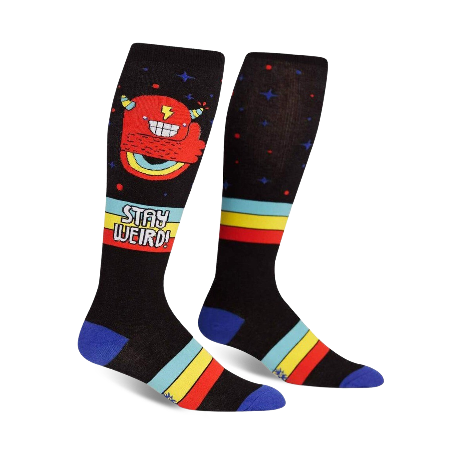 Pair of black knee-high socks with a red monster, rainbow, and retro stripes. Text reads 'Stay Weird!'