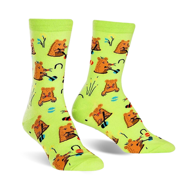 green crew socks feature a pattern of brown moles playing whack-a-mole in red, yellow, and blue hats, with flowers and grass.  