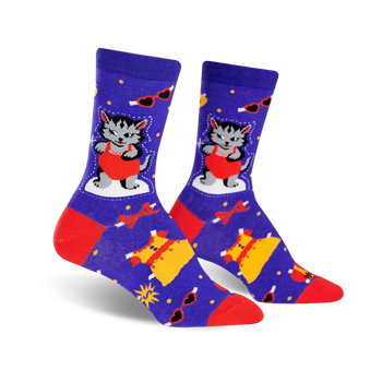 A pair of women's crew socks in purple, red, and yellow. The design features a cute cat in a red dress and other dress-themed elements.