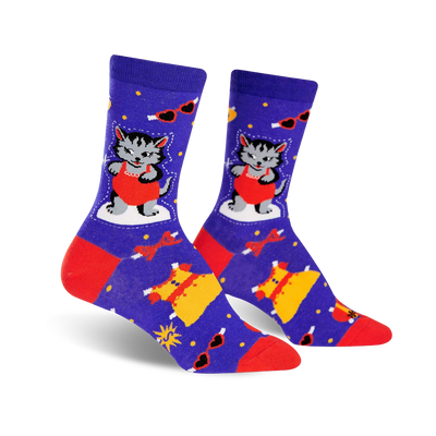 purple crew socks featuring a pattern of cartoon cats wearing red one-piece swimsuits, red bow ties, yellow dresses, and pink sunglasses.  