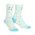 Pair of mint green crew socks with a cute bear face and colorful sprinkles design. Light blue heel and toe.