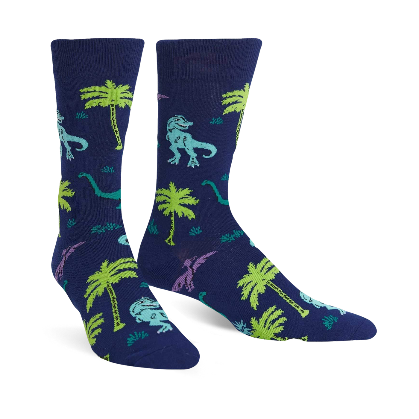Pair of navy blue crew socks featuring a fun pattern of green and purple dinosaurs and palm trees.