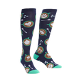 Pair of navy blue knee-high socks with latte art (hearts, horses, cats), teal spoons, and sugar cubes.
