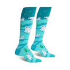 Pair of teal knee-high socks with a whimsical design of white polar bears and small green trees on a light blue background.