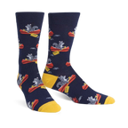 Crew socks in navy blue, featuring a repeating pattern of gray squirrels paddling red canoes. Yellow cuffs add a pop of color.