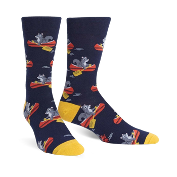mens navy blue keep on paddling socks feature cartoon raccoons in red/yellow canoes.   