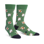 A pair of green crew socks with a repeating pattern of goats wearing bow ties. The goats are light brown and white.