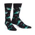 Pair of black crew socks with teal sharks wearing 3D glasses and small red fish. 
