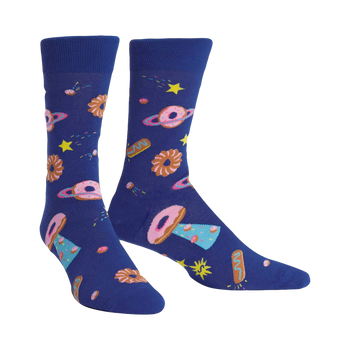 Pair of crew socks. Deep blue background with a pattern of donut-shaped planets, stars, and other space pastries in pink, brown, and light blue.