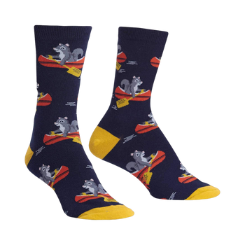 Crew socks in navy blue and mustard yellow, featuring a repeating pattern of squirrels paddling red canoes.