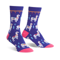 Pair of purple crew socks featuring white llamas with colorful saddles and small green trees. Pink toe and cuff detail.