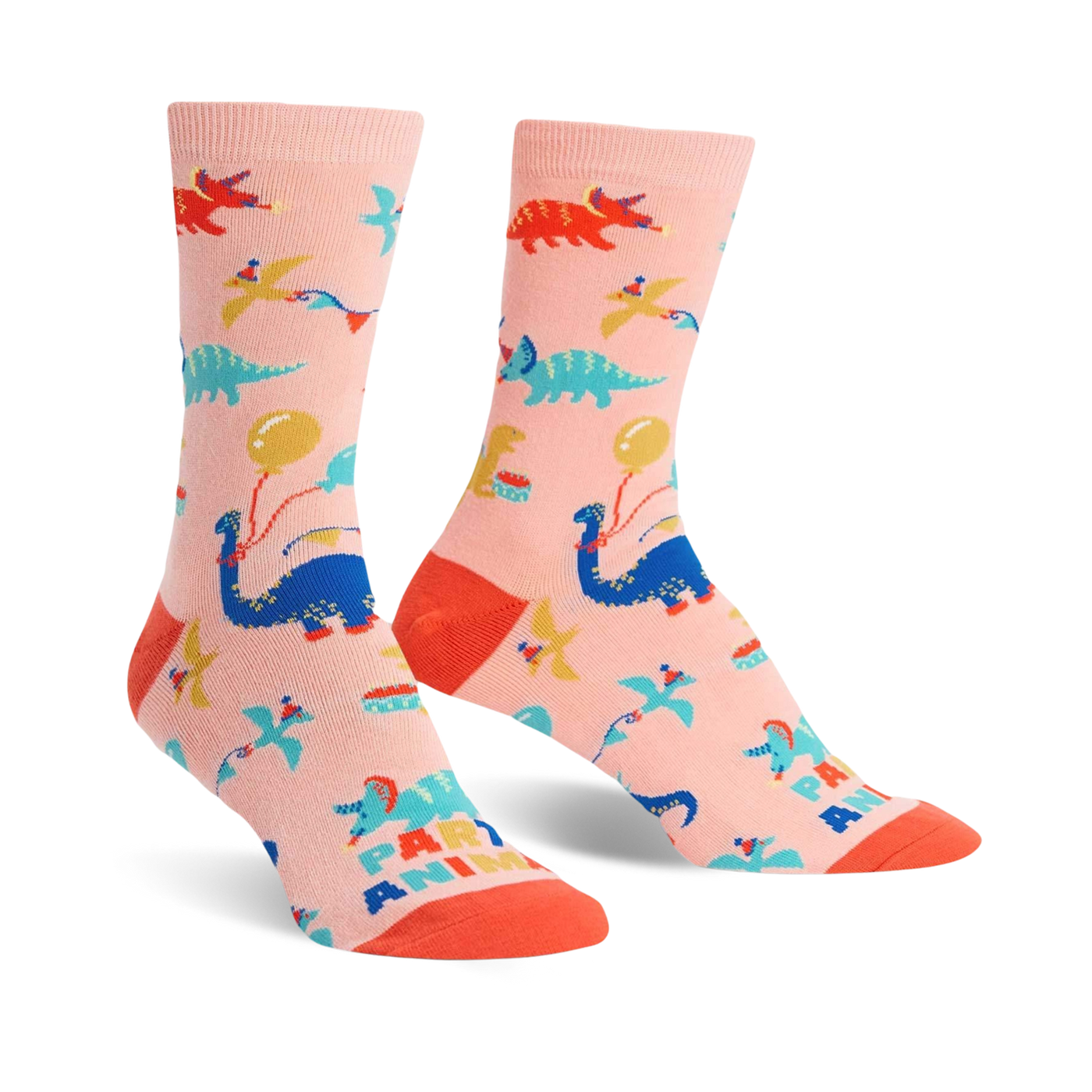 Crew socks in pink featuring colorful dinosaurs, balloons, and party hats. Fun, playful design.