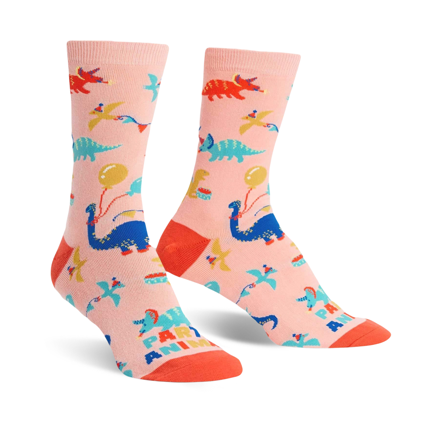 Crew socks in pink featuring colorful dinosaurs, balloons, and party hats. Fun, playful design.
