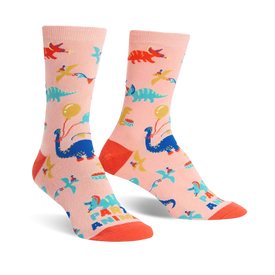 pink womens novelty crew socks with bright blue, green, and orange dinosaurs and balloons.  