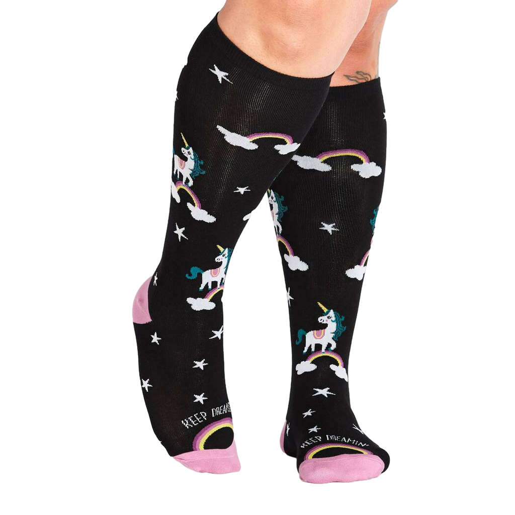 Lifestyle shot of model wearing the 'Keep Dreamin'' knee-high socks, showcasing the socks' fit and style.