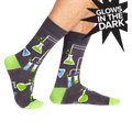 Crew socks in dark gray with a fun science design featuring beakers, flasks, and lime green accents.  They glow in the dark!