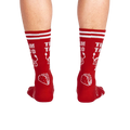 Rear view of a person wearing the red 'Team Taco' crew socks.