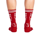 Rear view of a person wearing the red 'Team Taco' crew socks.